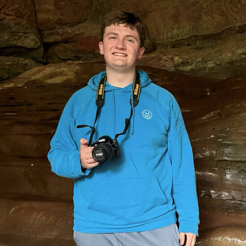 Picture of Drake in cave with a camera